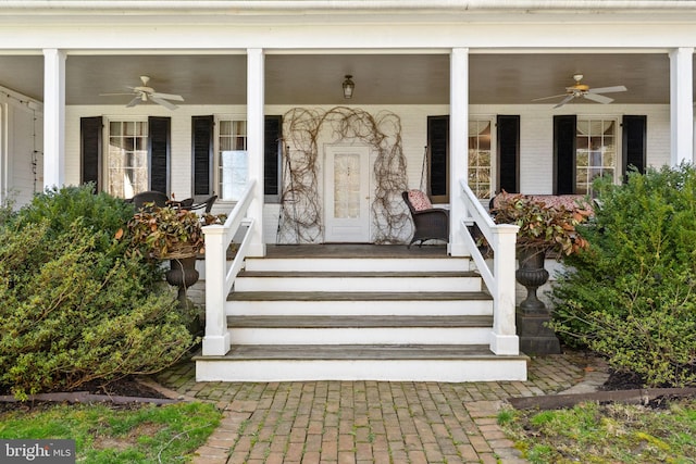 doorway to property with covered porch and ceiling fan