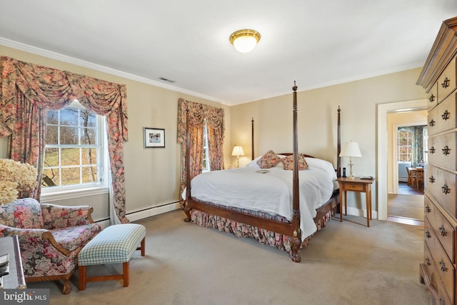 carpeted bedroom featuring ornamental molding and a baseboard heating unit