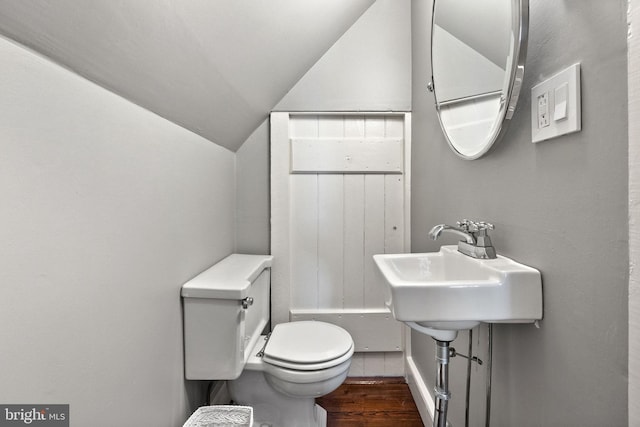 bathroom featuring toilet and lofted ceiling