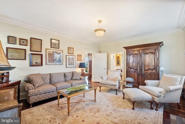 living room with light hardwood / wood-style floors and ornamental molding