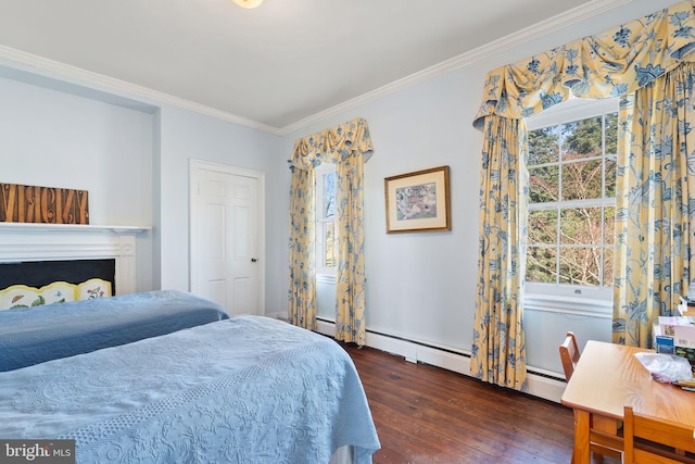 bedroom with dark hardwood / wood-style flooring, baseboard heating, and crown molding