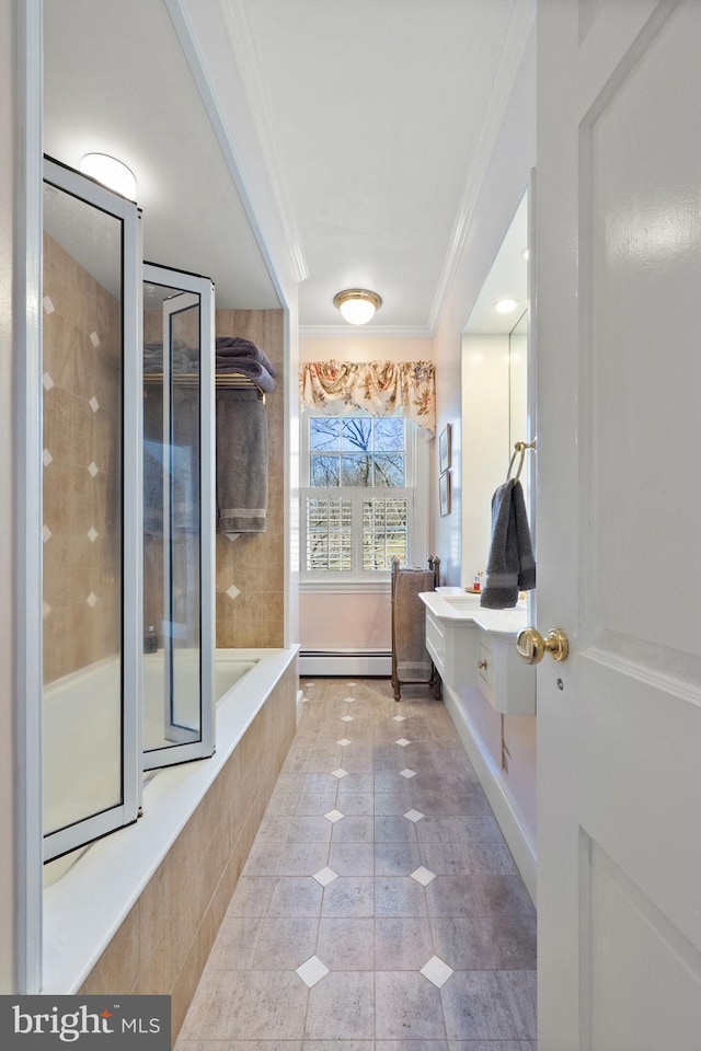 bathroom with tile patterned floors, vanity, a baseboard radiator, and ornamental molding