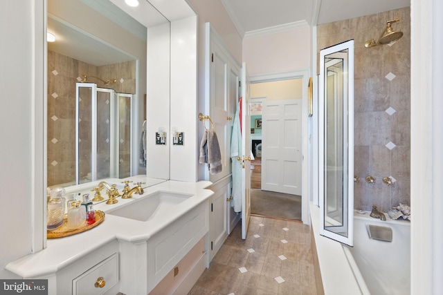 bathroom featuring tile patterned floors, vanity, a shower with shower door, and crown molding