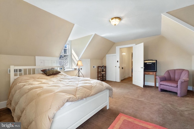 bedroom featuring carpet and lofted ceiling