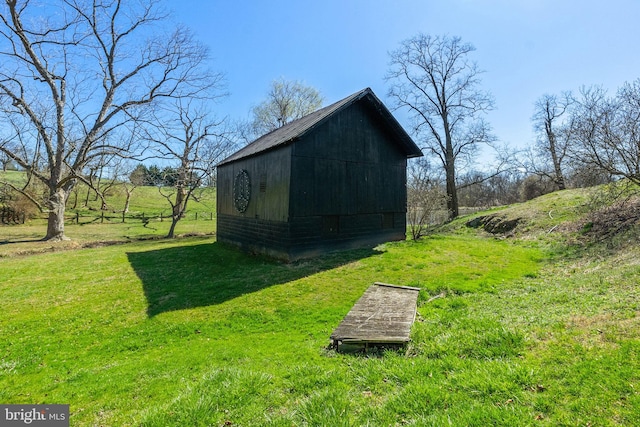 view of outdoor structure with a yard