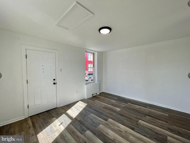 unfurnished room featuring dark hardwood / wood-style floors