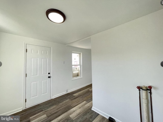 foyer entrance featuring dark hardwood / wood-style floors