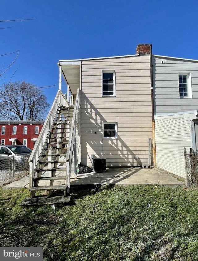 rear view of house with a patio