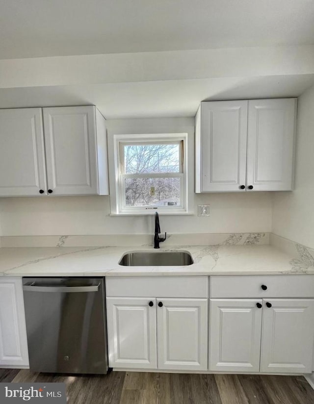 kitchen featuring white cabinets, dishwasher, dark hardwood / wood-style floors, and sink