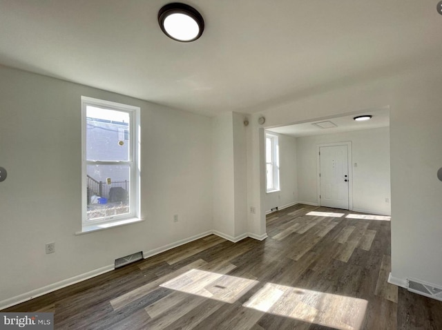 empty room featuring dark hardwood / wood-style floors