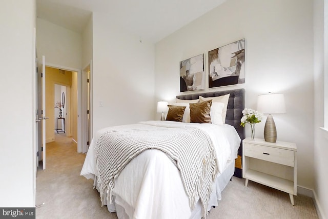 bedroom with light colored carpet