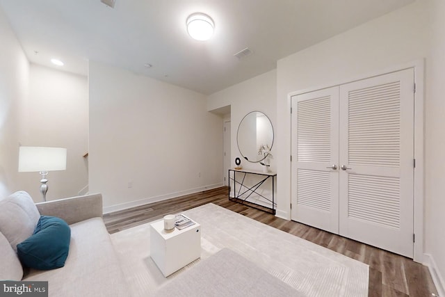 interior space featuring dark hardwood / wood-style floors and a closet