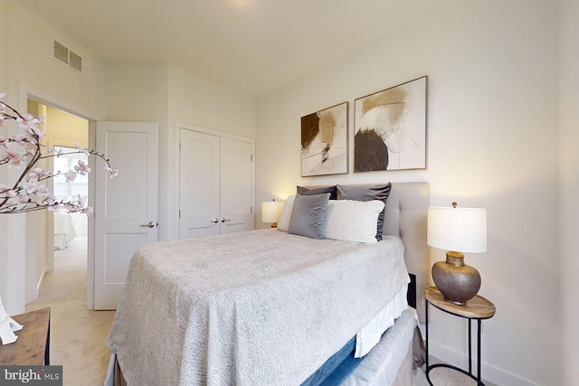 carpeted bedroom with a closet