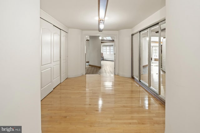 hallway featuring light hardwood / wood-style floors