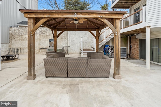 view of terrace featuring ceiling fan, outdoor lounge area, and a gazebo