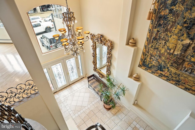 entryway with a notable chandelier