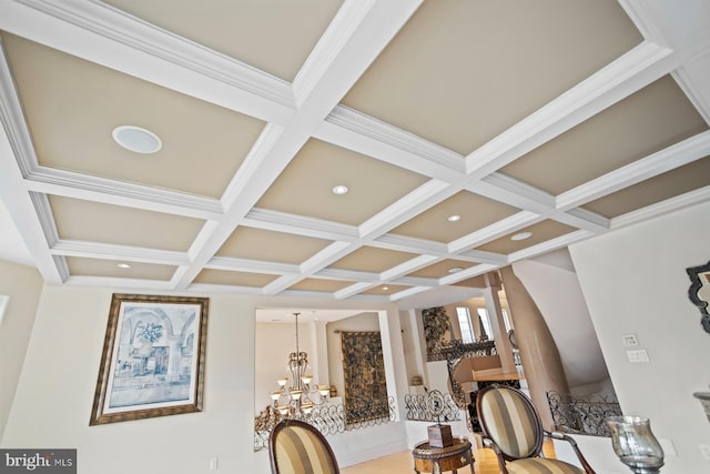 room details featuring coffered ceiling, a chandelier, and beamed ceiling