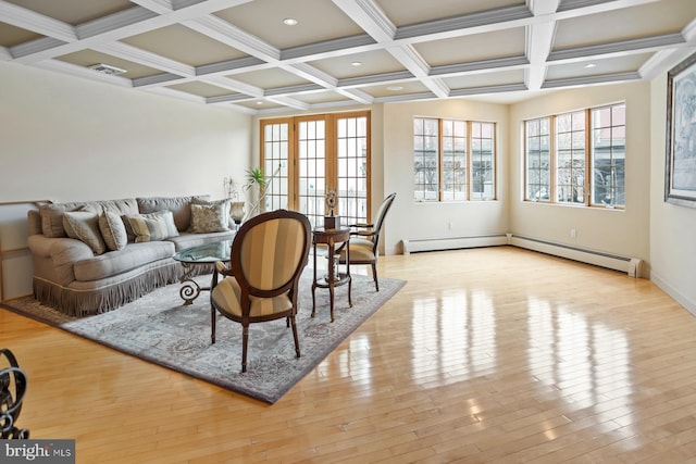 living room featuring french doors, coffered ceiling, a baseboard heating unit, and light wood-type flooring