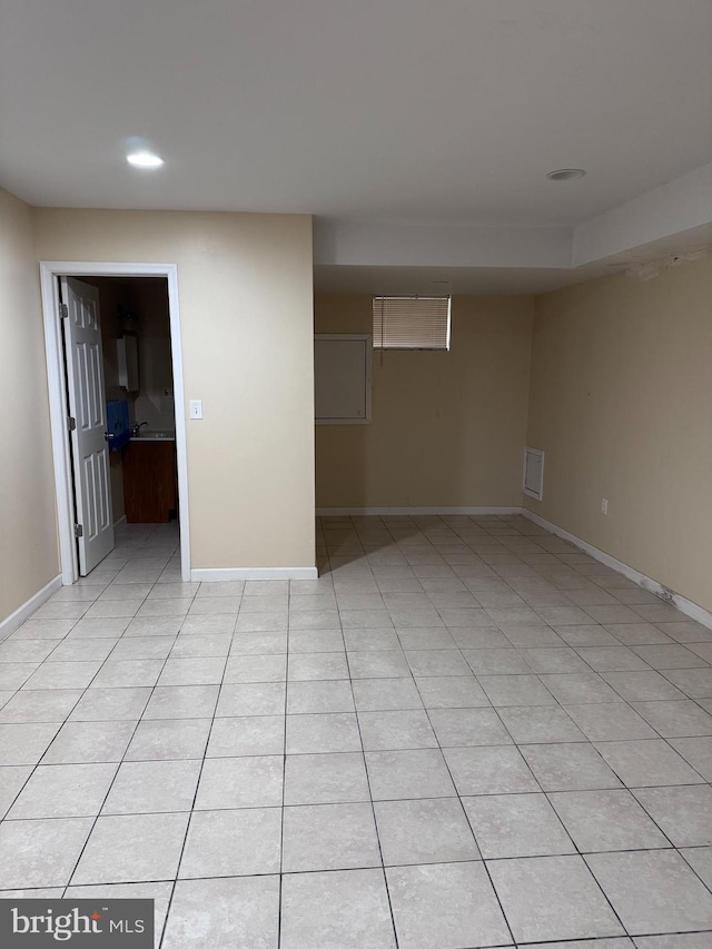 empty room featuring light tile floors