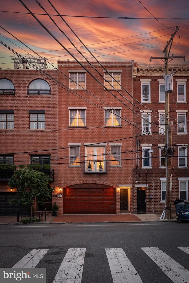 view of outdoor building at dusk