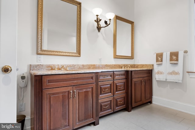 bathroom featuring tile floors, large vanity, and double sink