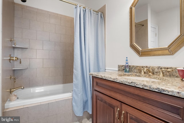 bathroom featuring vanity and shower / bath combo