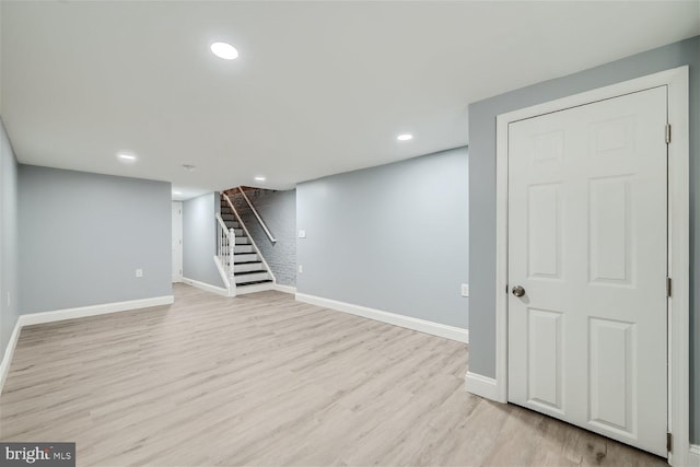 basement featuring light hardwood / wood-style floors