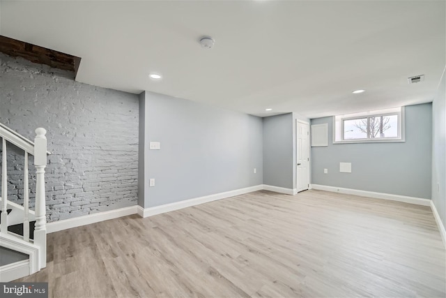 basement featuring light wood-type flooring