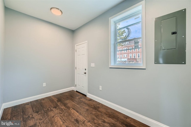 empty room with dark hardwood / wood-style floors