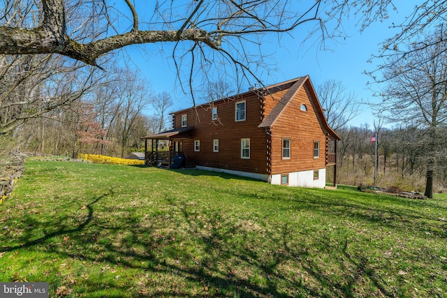 view of property exterior featuring a lawn