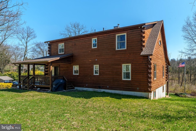 rear view of house with a lawn