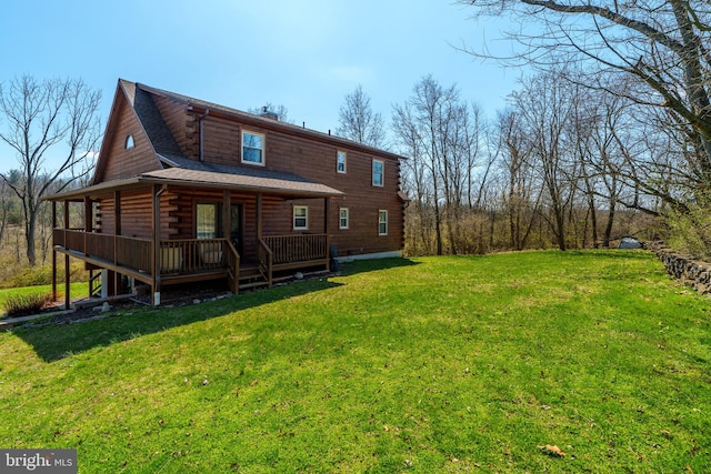 rear view of house with a lawn