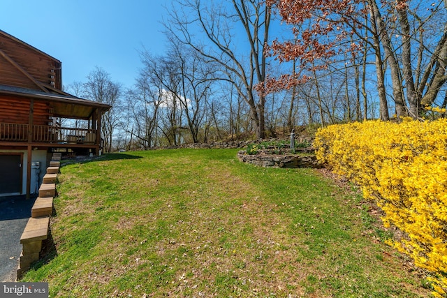 view of yard featuring a wooden deck