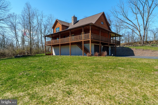 back of property with a lawn and a wooden deck