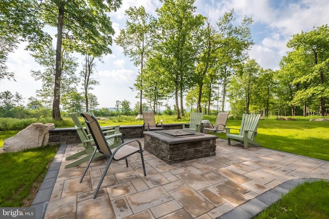 view of patio with a fire pit