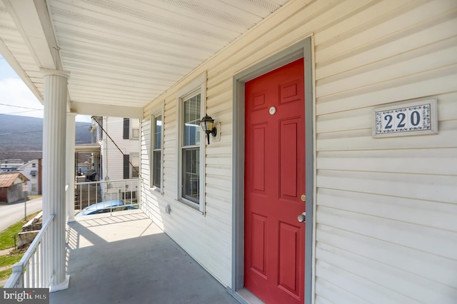 doorway to property with a porch