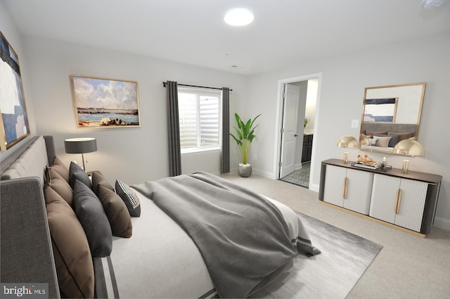 carpeted bedroom with ensuite bath