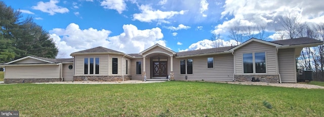 view of front of house with a front yard and central air condition unit