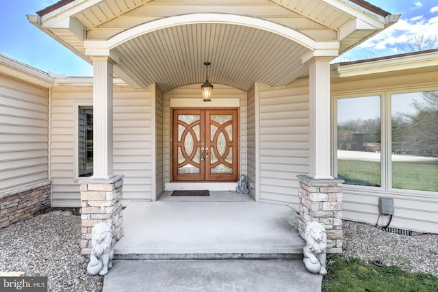 doorway to property with a porch