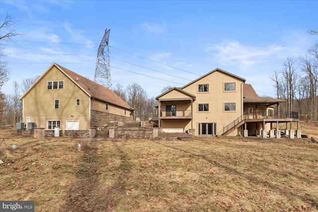 back of property featuring central air condition unit