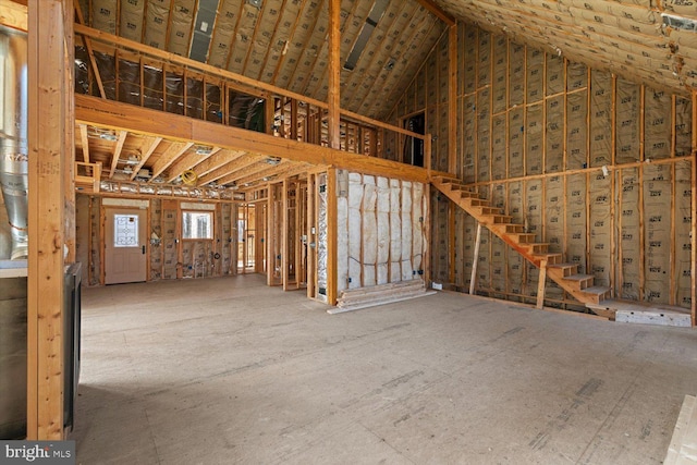 miscellaneous room featuring high vaulted ceiling