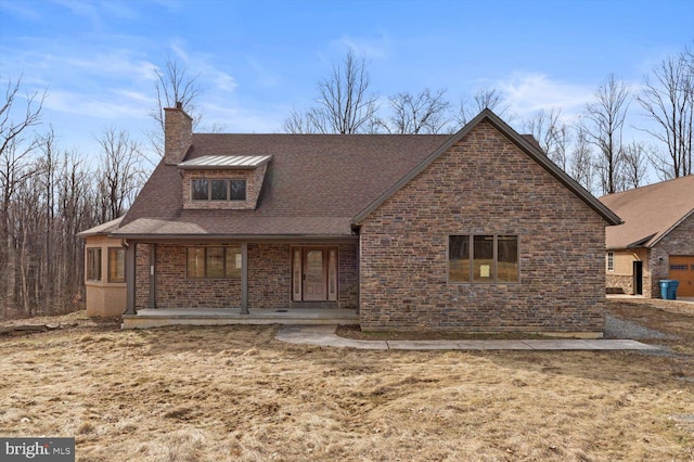 view of front facade featuring covered porch and a garage