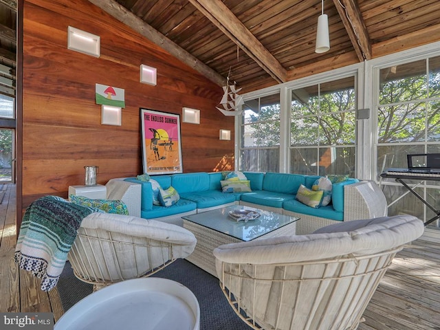 living room featuring lofted ceiling with beams, hardwood / wood-style flooring, wooden ceiling, and wood walls