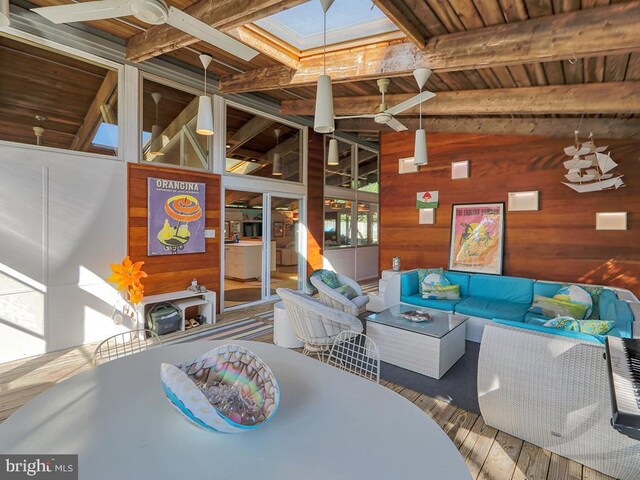 23 Jersey St, Dewey Beach, DE 19971 - living room featuring wood walls, a ceiling fan, wood ceiling, and wood finished floors