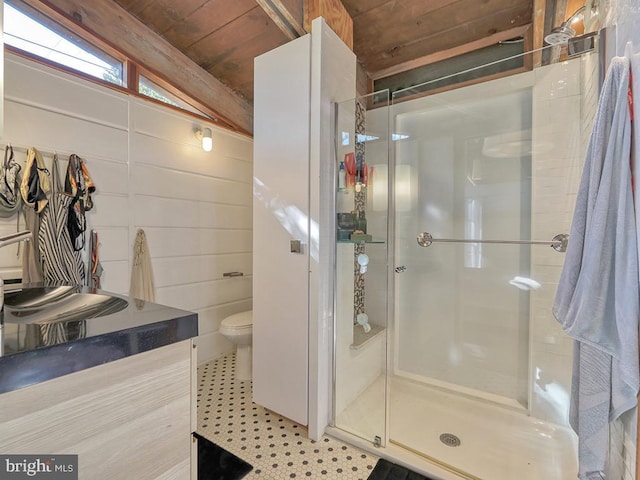 bathroom featuring toilet, vaulted ceiling, walk in shower, and wooden ceiling