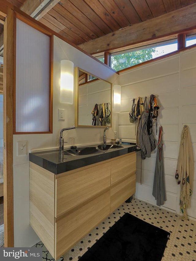 bathroom featuring beam ceiling, vanity, and wood ceiling