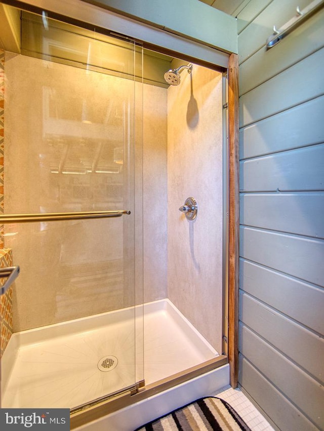 bathroom featuring tile patterned flooring and walk in shower