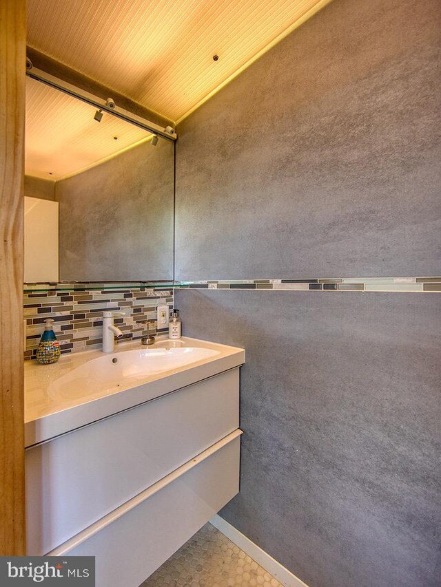 23 Jersey St, Dewey Beach, DE 19971 - bathroom featuring vanity and backsplash
