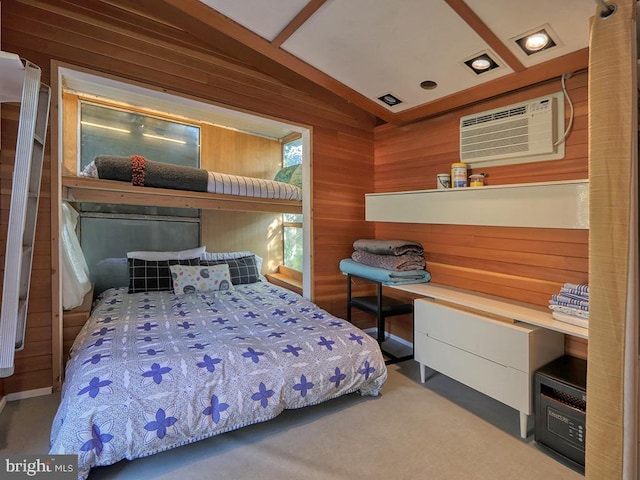 bedroom with a wall mounted air conditioner, lofted ceiling, carpet floors, and wooden walls