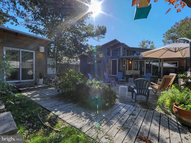 23 Jersey St, Dewey Beach, DE 19971 - deck featuring an outdoor living space